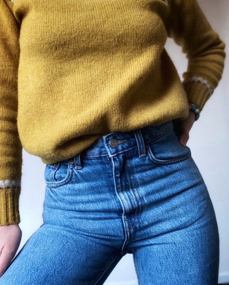 Yellow jumper and blue jeans