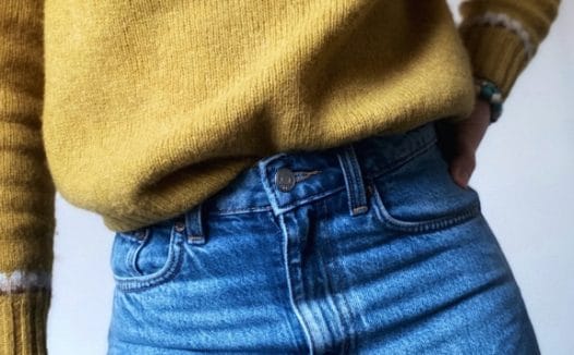 Bright yellow jumper, blue jeans